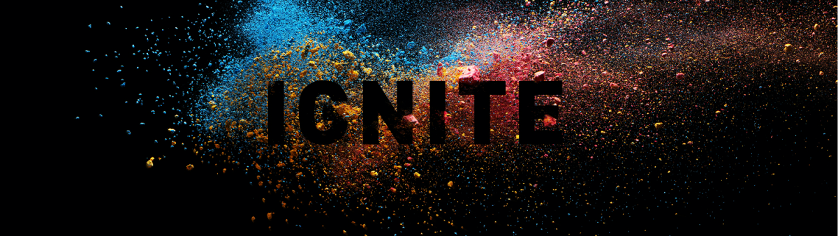 A paint explosion on a black background with the word Ignite overtop